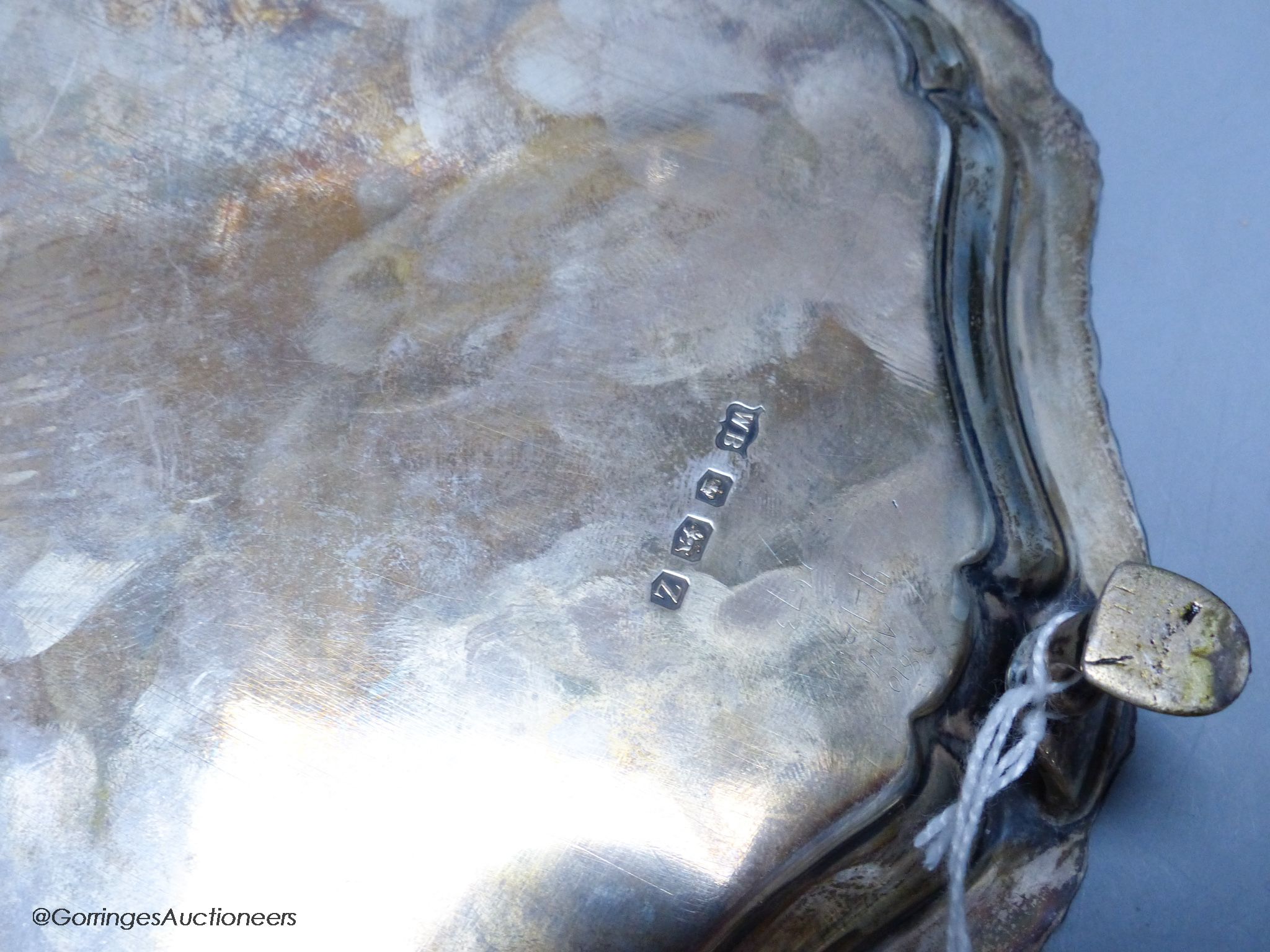 A circular silver waiter, with gadrooned piecrust edge, on four hoof feet, 11.46oz